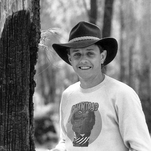 The author in Central Queensland near Carnarvon Gorge in 1984, wearing the Akubra hat and standing next to a large tree